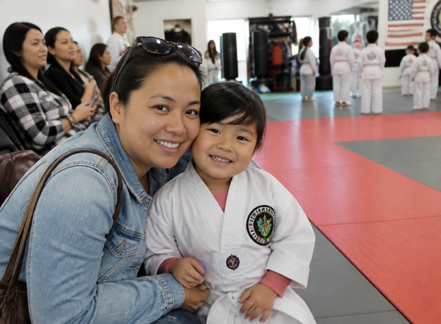 A parent and child at Sud'n Impact before youth martial arts class