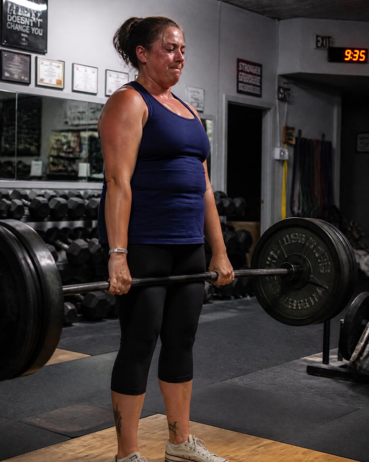 Member lifting free weights at a 24 hour gym in Fort Wayne